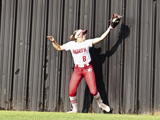 North Rock Creek's Aubree Shivelhood make a catch at the wall. Photo courtesy of Gowin Photography
