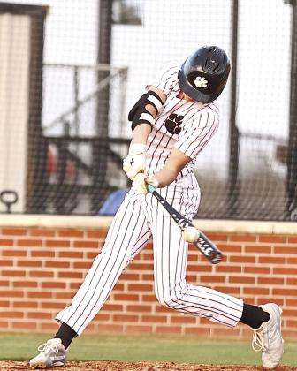 North Rock Creek's Landon Rosser connects for a single. The Cougars beat Glenpool 11-5, Monday, Mar. 31. Photo courtesy of Gowin Photography