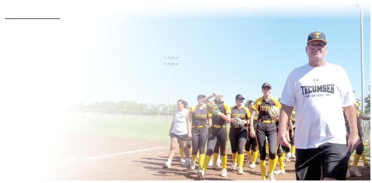 TPS Fastpitch Softball Coach Chad Trahan will be inducted into to the Oklahoma Coaches Association Hall of Fame this summer. Pictured above is Trahan with the Lady Savages team behind him. Photo provided