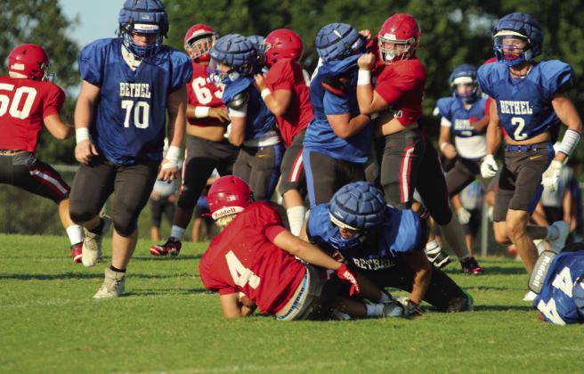 Bethel senior Luke Quinter tackles North Rock Creek's #4 in a scrimmage on Aug. 22. They also faced off against Bridge Creek. Bethel's first home game of the season is on Sept. 12 at 7 pm against McLoud, and North Rock Creek plays at home, after two away games, on Oct. 10 at 7 pm with Pauls Valley. Cheyanna Dietz, Countywide &amp;amp; Sun