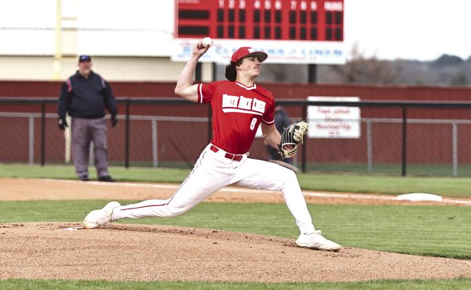 North Rock Creek Senior Kaleb Boatman winds up for the pitch against Lincoln Christian Monday, March 20. NRC lost the game 20-1.
