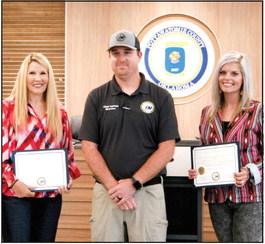 Chad Larman, Pottawatomie County’s Director for Emergency Management, presenting recognition awards to Melissa Dennis and Abby Thompson, the County Commissioners for Pottawatomie County during the weekly Pottawatomie County Board of Commissioners meeting on Tuesday, May 30th. Countywide &amp;amp; Sun/Valerie Scott