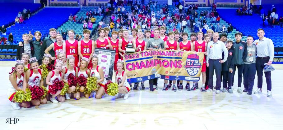 The Class 2A Dale Pirates basketball team, their coaches and the Dale cheerleaders pose after winning the 2022 Tournament of Champions in Tulsa on Dec. 30. They are the first small school to win the tournament since 1978. The team returned to defend their title in the 58th TOC on Dec. 27, 2023. Photo provided.