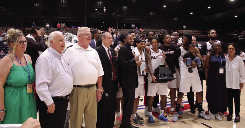 The Potawatomi Fire won The Basketball League National Championship on June 27, and Fire Guard Chuck Guy was named co-MVP, along with 2022 MVP Deshawn Munson. Here, Guy is holding “The Lillie” TBL 2023 Champions trophy, after they won two out of three games with the St. Louis Griffins. File photo