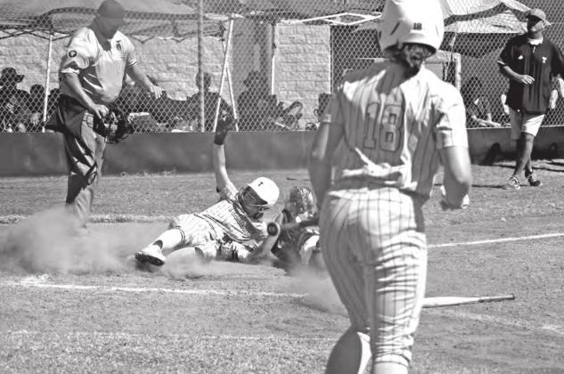 Tecumseh’s Emily Bingham slides as she steals home during the third inning of the 4A regional game against Blanchard on Oct. 8. After winning that, their third regional game, 8-3, Tecumseh advances to state today (Oct. 14) at 11 am. Countywide &amp;amp; Sun/Natasha Dunagan