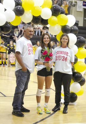 Tecumseh senior Rhylee Nadeau poses with her parents during Volleyball Senior Night on Sept. 25. THS celebrated nine seniors, including Maci Flowers, Destiny Gains, Andrea Knight, Harley Scott, Arianna Vermillion, Zoey Falcon, Karsyn McDonald, Nadeau and Laynie Sanders. Countywide &amp;amp; Sun/Natasha Dunagan