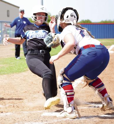 Pictured right, Bethel ’s Chloe Sheppard reaches for home plate while trying to avoid the tag. Chandler won the match up 12-3. Photo courtesy of Brian Blansett