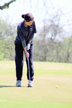 Tecumseh senior Kaydence Hale takes her ball one stroke closer to the hole. Natasha Dunagan, Countywide &amp; Sun