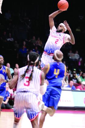 Potawatomi Fire Guard and Forward Jachai Simmons rises above the competition to sink a rebound in the fourth quarter of the Western Regional Championship on June 15. The Fire beat the Great Falls Electric, 131-113, for their second game, and advance to The Basketball League Finals on Saturday at FireLake Arena. Simmons led the Fire with 29 points, his highest this season, according to potawatomifire.com. Natasha Dunagan, Countywide &amp; Sun