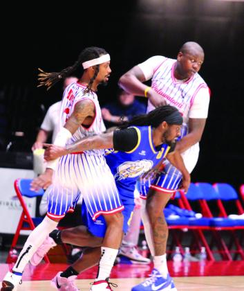 Former Fire player KD Moore breaks through Fire defenders Ricky Artis II and Paul Harrison after losing the ball. Natasha Dunagan, Countywide &amp;amp; Sun
