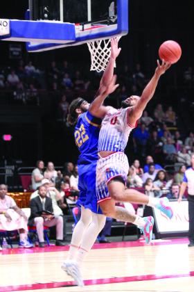 Potawatomi Fire Guard Deshawn Munson gets blocked at the bucket during the Western Regional Championship on June 15. The Fire beat the Great Falls Electric, 131-113, for their second game, and advance to The Basketball League Finals on Saturday at the FireLake Arena. Munson achieved his third triple-double with 19 points, 11 rebounds and 12 assists, according to potawatomifire.com. Natasha Dunagan, Countywide &amp; Sun