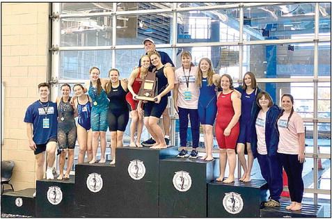 The Shawnee High School Girls Swim Team won the Class 5A State Championship Meet, Feb. 17-18, as well as several individual events. Shown, from left, are Team Manager Trent Ogden, Ashley McDonald, Harlee Bullard, Gracyn Simpson, McKayla Tinkle, Natalie Selman &amp; Piper McNeil (holding trophy) Assistant Coach Bob McNeil, standing behind them, Head Coach Valarie Colburn, Clara Timmons, Emma Oller, Tenielle Kidd, Kelly Templeton, and Jadelyn Shotts. Photo provided.