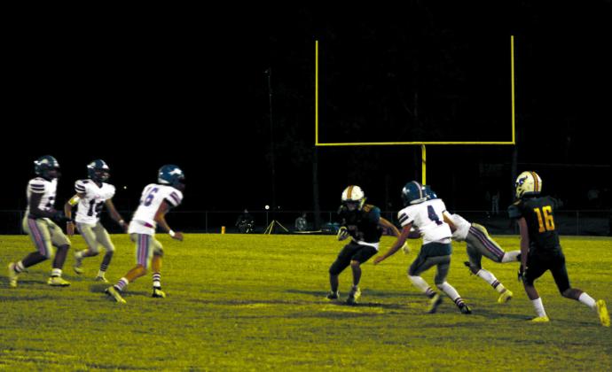 After receiving a pass from Bethel junior Reagan Curry, freshman Zack Griffith gains some yardage in the fourth quarter of the home game against Chandler on Oct. 7. Chandler won 48-15.