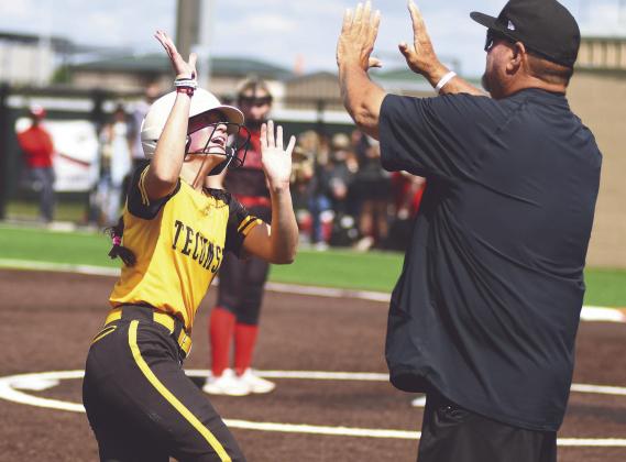 Tecumseh sophomore Maddie Gray gets a high-five from Head Slow Pitch Coach Perry Wilson during the Class 5A State Tournament held at FireLake Ball Fields on May 8. Photo courtesy of Brian Blancett, Lincoln County News