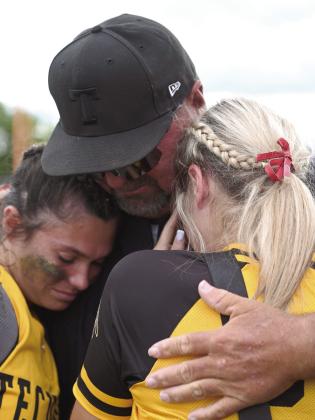 Slow Pitch Head Coach Perry Wilson consoles seniors Kynlee Donaghey and Aleigha McCullough after losing to North Rock Creek. Photo courtesy of Kenetta Lisenbee