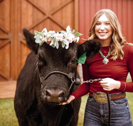 Shawnee State FFA Degree Recipient Eva Webb poses with her Angus heifer Pickles. Webb had two heifers and a bull for her SAE. Photo provided.