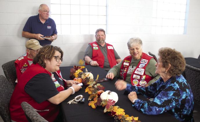 Louann Parsons, of Missouri, far right, talks with members of the Assemblies of God Church Mobilization and RV Volunteers group during the grand opening of the Tecumseh First Assembly of God Family Youth Center on Nov. 9. Parsons is the sister-in-law of the church's founding pastor Robert Rider, and the church was also celebrating their 75th anniversary. Shown, clockwise from left, are Alesa Miller, Dan Earnest, Greg Hurta, Jeff Miller, and Dianne Earnest.