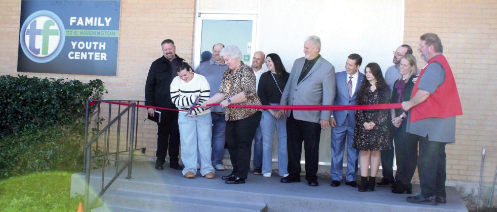 The ribbon is cut for the opening of the Tecumseh First Assembly of God Family Youth Center at 112 E. Washington on Nov. 9. See full cutline below.