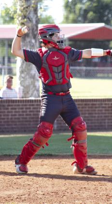 Dale senior Ethan Douglas throws back to the pitcher in the April 22 game with Ripley.