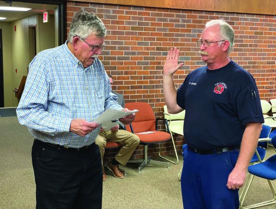 Fire Chief Rhett Banks takes a Loyalty Oath read by Mayor Parker as the official Emergency Management Director to cover a FEMA paperwork technicality. Countywide &amp;amp; Sun/Julie Talton