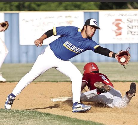 Bethel’s Paul Villegas stops the throw from the catcher.