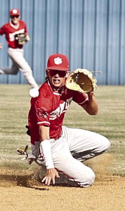 North Rock Creek’s Carson Wilburns makes the stop of the hard hit ball.