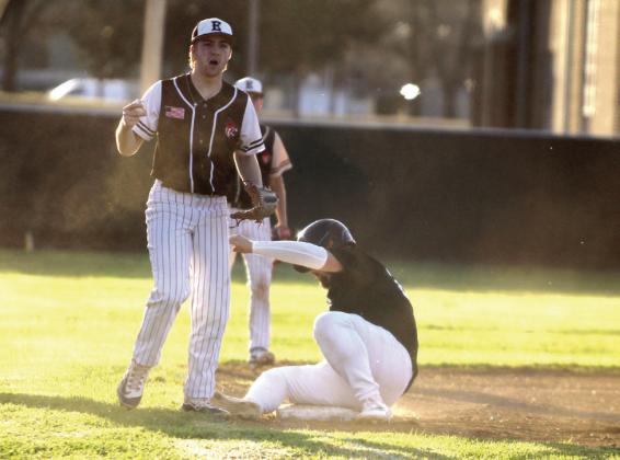 Earlsboro's Jon Wilkins plays third base after Jesse Siqueiros, on the Maud/Macomb co-op team, slid into the base on March 11. Natasha Dunagan, Countywide &amp;amp; Sun