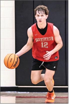 NRC Senior Kohen Warden brings the ball up court during the scrimmage against Anadarko on Nov 15. Photo courtesy of Gowin Photography