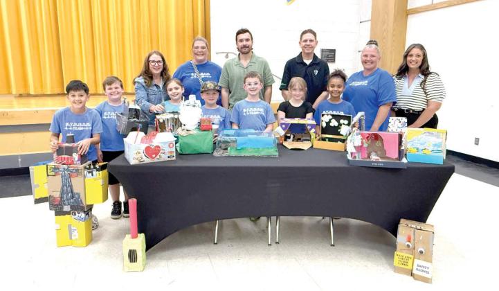 The Barnard Elementary STREAM (Science, Technology, Reading, Engineering, Arts and Math) team posed with the Tecumseh School Board after sharing their diorama projects. Projects varied from weather to instruments. Julie Talton, Countywide &amp; Sun