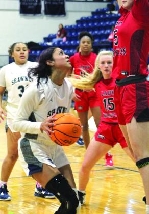 Shawnee senior Amaya Martinez gets the rebound from her shot and makes a basket in the third quarter.
