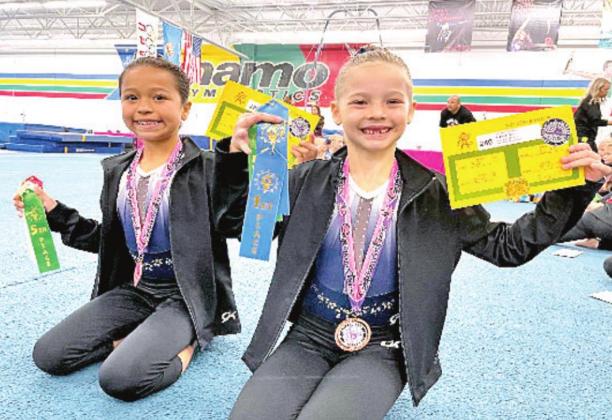 Level 2 gymnasts pictured above are Alye Ramirez and Kara Robbins. Photo provided