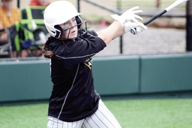 Taylor Gage sends the ball flying in the Regional game with Chandler.