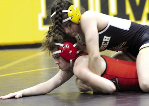 Tecumseh’s Trinity Rakestraw tries to flip McLoud’s Laine Walker during the homecoming dual meet on Jan. 10 at the Tecumseh Middle School Gym. Rakestraw won the match. Countywide &amp;amp; Sun/Natasha Dunagan