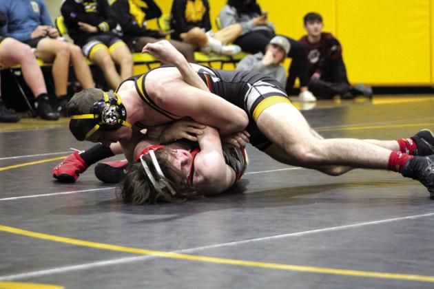 In the 144-pound class, Tecumseh’s J.D. Sigman pins McLoud’s Ryker Butler during the homecoming dual meet on Jan. 10 at the Tecumseh Middle School Gym. The McLoud Redskins won 38-33, and the Lady Redskins won 48-24.