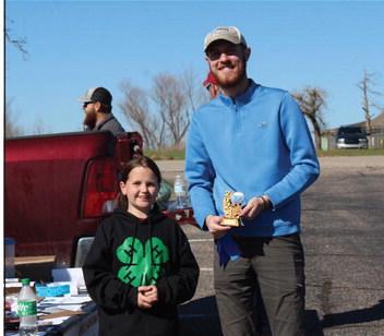 Bethel 4-H Club member Jessilynn Kuchynka presents the First Place Adult trophy to Seth True for catching a 3.62-pound large mouth bass during the Oklahoma Fishing in the Schools 4-H Fishing Tournament. Kuchynka and her mother, Caitlin Kuchynka, organized the event on March 9 at Shawnee Twin Lake #1. Countywide &amp; Sun/Natasha Dunagan