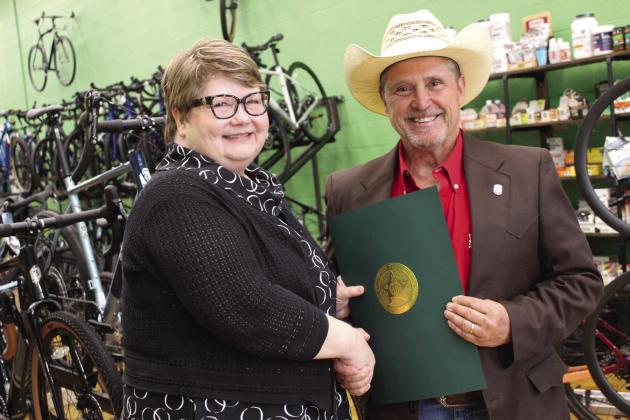 Oklahoma State Representative Danny Sterling, right, presents a citation of recognition on behalf of the Oklahoma House of Representatives to Mary Carter, of Tecumseh, during a reception at SpOKeLAHOMA on May 3. Carter was inducted into the Oklahoma Journalism Hall of Fame on May 2 at the University of Central Oklahoma. Sterling read the citation aloud before presenting it. He said Carter began working for the Countywide News at age 15, performing various jobs in the office.
