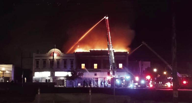 Sometime around midnight or 1 am, a fire downtown fully engulfed the top floor of the building that housed Bugatti Buds and Candy Licker.. Shawnee Fire Department is dousing the roof of The Ritz in an attempt to keep the fire from spreading. A Facebook post by The Ritz said it has water damage, but had not been inside to see if there was any additional damage at the time of publication. Photo courtesy of Rob Morris