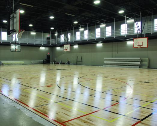 The Troy and Dollie Smith Family YMCA in Shawnee has been rebuilding from the April 19, 2023 tornado with new windows, paint, flooring and lighting in almost every room. The basketball court, shown here, is also new, with lines painted for pickleball in case that’s needed. Countywide &amp; Sun/Natasha Dunagan