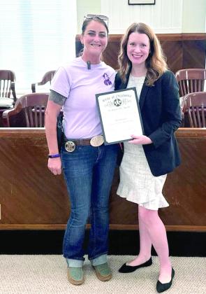 Lt. Dakota Black (le_) nominated Assistant District Attorney Lori McConnell with a Domestic Violence Awareness Award. Countywide &amp;amp; Sun/