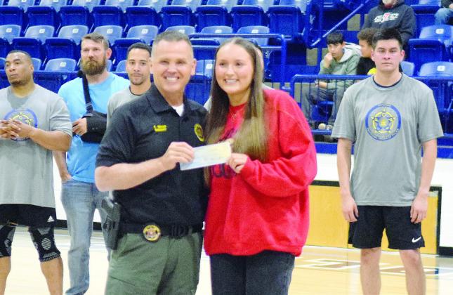 Sheriff Freeland Wood presented a 2025 Freeland Wood Scholarship in the amount of $1000 to North Rock Creek High School Student, Olivia Bergsten. Julie Talton, Countywide &amp; Sun