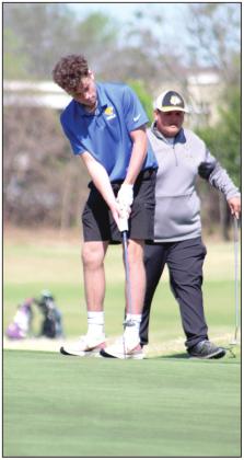 Bethel sophomore Campbell Freed putts at the seventh hole, as Bryscon Cosper, a Tecumseh sophomore, waits his turn during the tournament, on April 14.