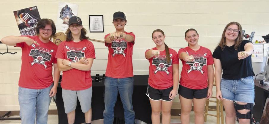 Members of the 2024-25 North Rock Creek Archery Team: Brayson Searcy, Austin Wilkins, Joel Vincent, Makenna Rudek, Makayla Rudek and Courtney Grace show off their newly acquired Archery State Championship rings. Photo Provided