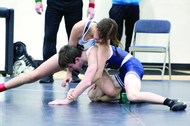 Pictured above, Shawnee’s Eliana Banks wrestles Blayn Gaber during the Blue and White Duals on Nov. 29. Head Coach Andrew McCune said this event is “like a practice. These are matches for us to evaluate to see who will start in my varsity line up for duals.” Shawnee wrestled their first official dual against Del City on Dec. 6.