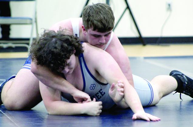 Pictured left, Shawnee’s Logan Cash and Beau Skelton wrestle each other during the Duals on Nov. 29.