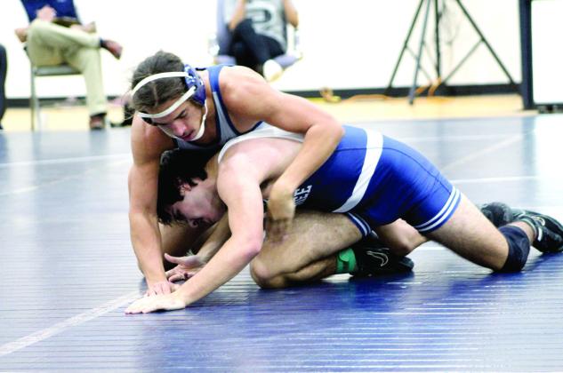 Pictured above, Shawnee’s Chaysin Mc-Clain, top, takes on Holland Ryder.