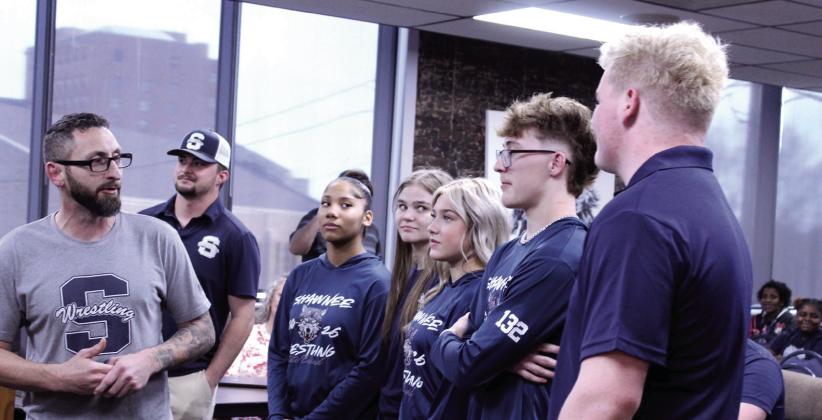 Shawnee Head Wrestling Coach Andrew McCune, far left, introduces the high school wrestling state qualifiers during the March 9 Shawnee Board of Education meeting. Shown from left are McCune, Assistant Coach Will Hilton, Ayanna Cruz, Claudia Thomason, Silver Belvin, Stetson Tucker and Logan Skelton. Not pictured are Booker Dahlman and Za’Karia McClain. Natasha Dunagan, Countywide &amp;amp; Sun