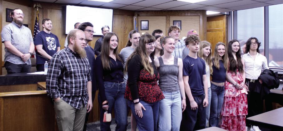 Members of the Shawnee Swim Team and their Head Coach Nolan Price, front row.far left, were recognized for competing at the state level recently, during the Shawnee Board of Education meeting on March 9. Natasha Dunagan, Countywide &amp;amp; Sun