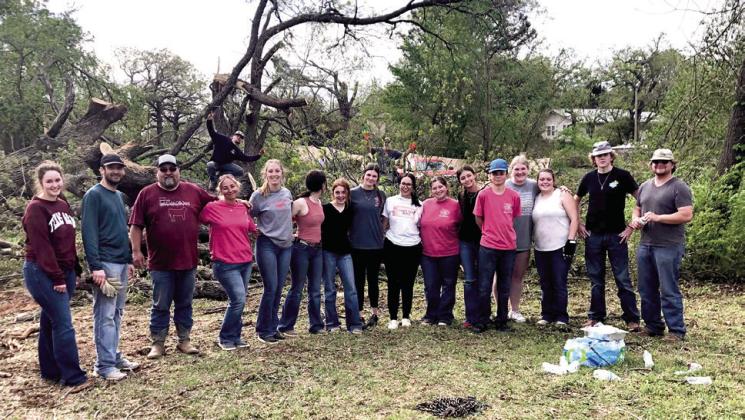 Tecumseh FFA members and advisors pose for a photo while helping with cleanup at the Lindsey/Rawlins property after the tornado on April 19. Photo provided