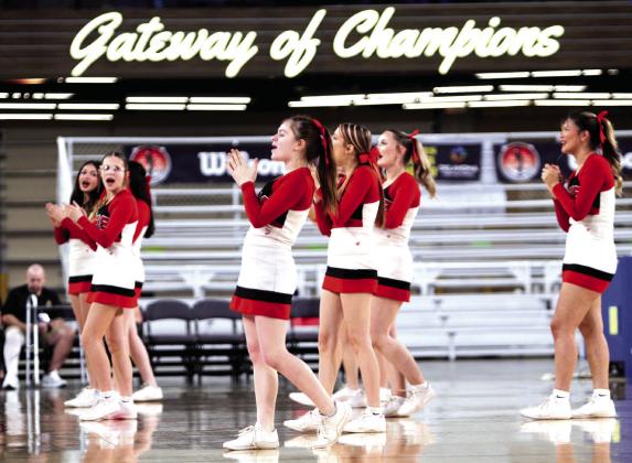 The McLoud High School Cheerleaders rally the Lady Redskins fans during the Class 4A State Quarterfinals, held at the OG&amp;E Coliseum on March 10.