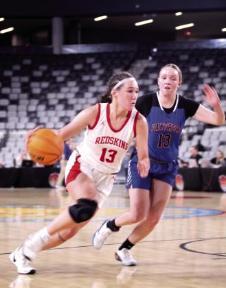 McLoud junior Creighton Conley drives to the hoop during the Class 4A State Quarterfinal game against Harrah.